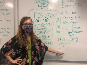 Megan Mavity in classroom in front of whiteboard