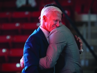 Coach McKillip Hugs Steph Curry during Curry for Three Ceremony