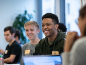 John Billups ’22 smiling in classroom