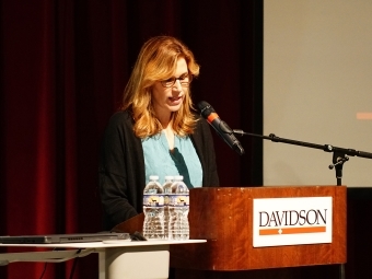 Writer Molly Sentell Haile speaking at podium