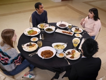 Students at table with food in front of them