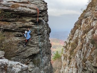 Student climbing mountain