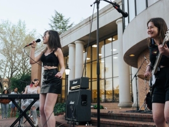 Students singing on stage