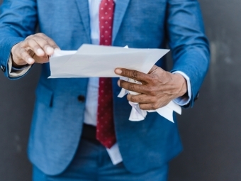 Hands holding papers