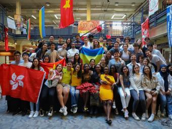 Dymtro Kurdydyk and Valeriia Kruzhkova hold Ukraine’s blue and yellow flag at the college’s International Festival in October.