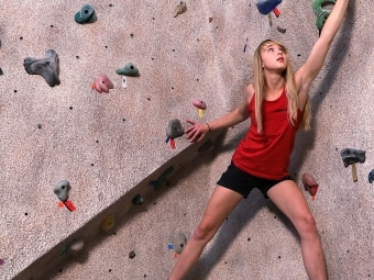 Climber Bimini Horstmann on DO Bouldering Wall