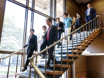 Koji Tomita '77 walking through the library