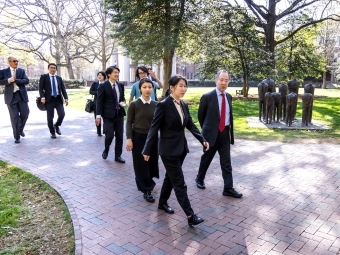 Koji Tomita '77 walking through campus