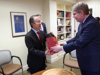 President Doug Hicks giving gift to Koji Tomita
