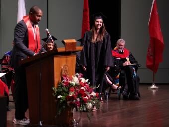 Student being recognized onstage at Convocation