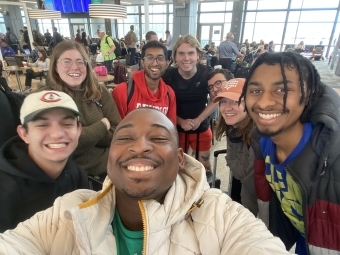 Group of students taking a selfie in the airport