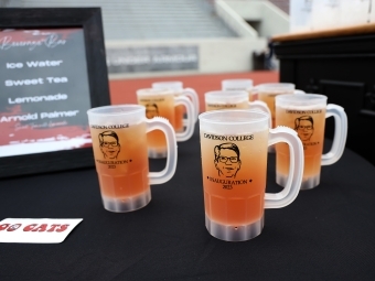 Doug mugs filled with iced tea on a black table