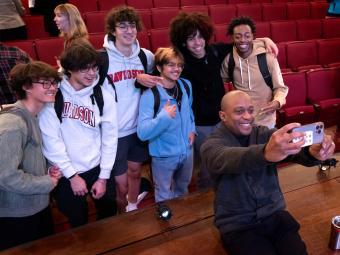 Unveiling of the Commemoration Design - Hank Willis Thomas taking selfie with students