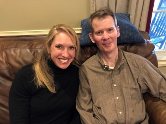 Wells and Alex sitting on couch