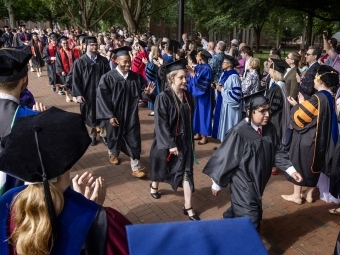 Graduation procession of students in caps and gowns