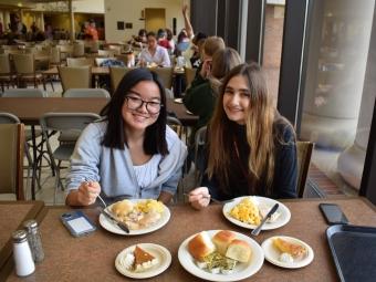 Two students enjoying lunch at Vail Commons