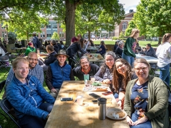 Faculty and Staff at Outdoor Table during Verna Miller Case Symposium