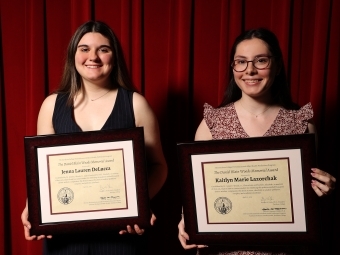 Award winners holding their certificates