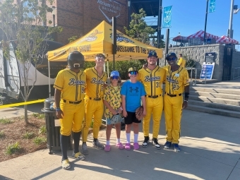 Collin Strickland (third from right) with friend Bryce Henrickson and a few Bananas at the July 11 game in Kannapolis.