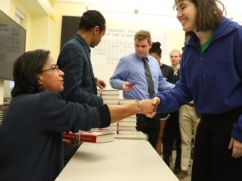 Susan Rice Shakes Hand with Student