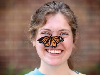 Ellie Rice with monarch butterfly on her nose