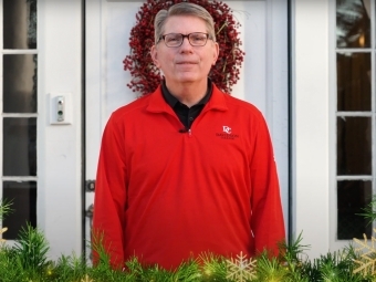 President Hicks in front of white door