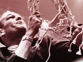 Charles “Lefty” Driesell removing the net after a basketball game