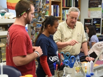 Professor Malcolm Campbell with students in the lab