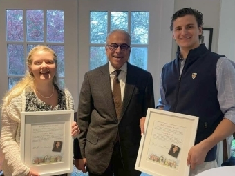 Economics 2024 award recipients during ceremony with Kelly Chaston’s husband