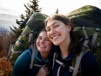 Smiling students on backpacking trip