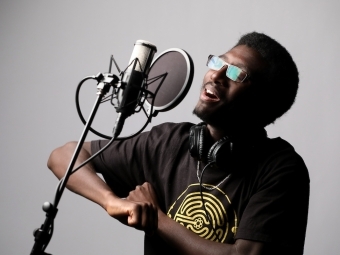 Victor Alan Weeks singing in a microphone