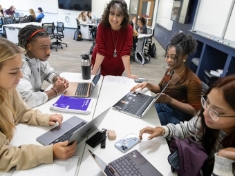 Students in a classroom with Professor of Biology Karen Bernd