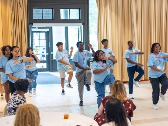 Summer Promise participants learning step to teach coding concepts