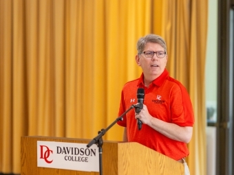 President Douglas Hicks '90 speaks at podium