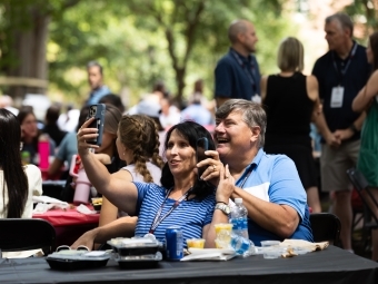 Parents take a selfie at the orientation picnic