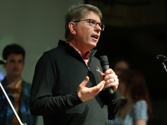 President Doug Hicks speaking to students