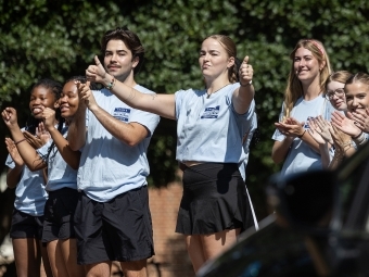 Students applauding at move-in 2024