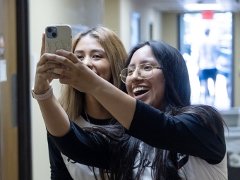 Students taking selfie in residence hall