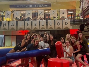 a group of students on an inflatable smiling