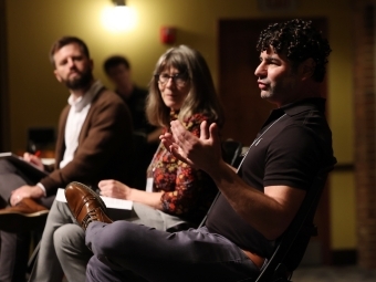 Dan Layman, Associate Professor of Philosophy, Davidson College, Shireen Campbell, Professor of English and Dave Tomar, author of The Shadow Scholar speaking on stage