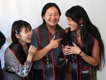 a group of young people smiling together