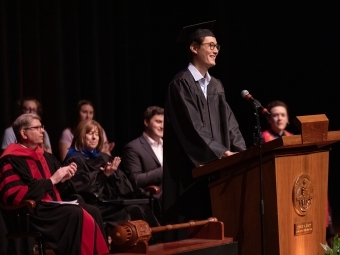 Class President Oliver Poduschnick ’25 speaks during convocation