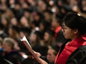 Student reading during Convocation 2025
