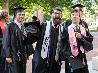 Commencement 2025 three happy grads
