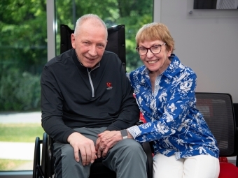 an older white man and his wife sitting together