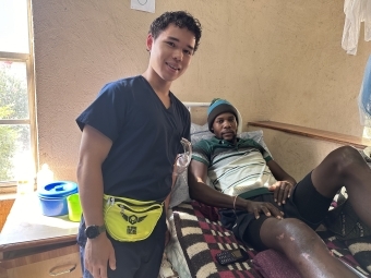 Thomas Lane treats a patient at the Mwandi Mission Hospital in Zambia.