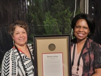 Michelle Serrano ’90 with Muadi Mukenge ’90