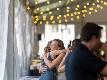 Alums hugging at Reunion 2025
