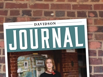 a magazine cover on a brick pathway that reads "Davidson Journal"