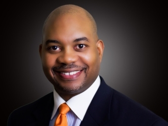 Linsey Mills '92 wearing an orange tie